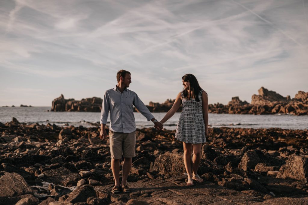 couple holding hands and looking at each other