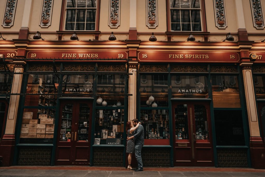 Couple hugging in Leadenhall Market for their engagement session