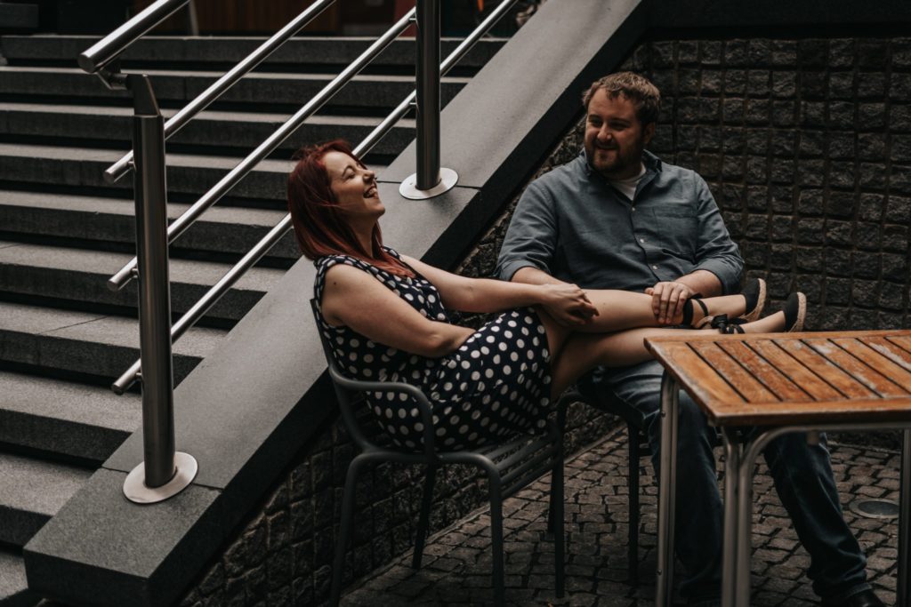 couple chilling in cafe and laughing