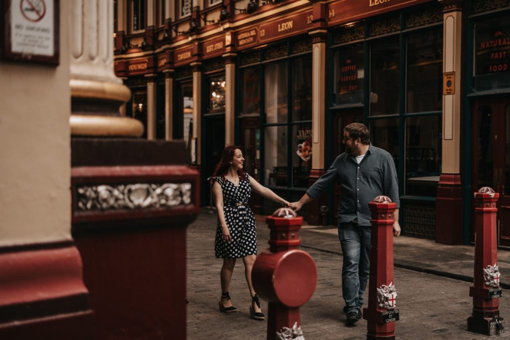 couple walking through Leadenhall market