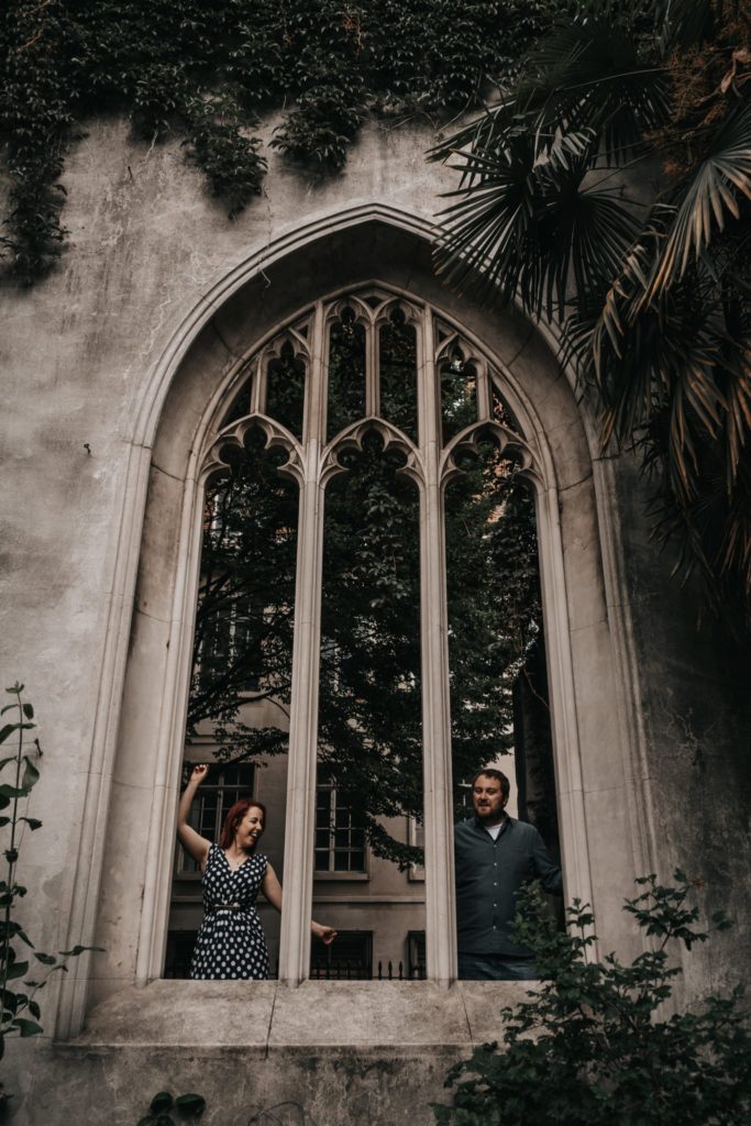 couple having fun at their engagement photoshoot at St Dunstan in the east