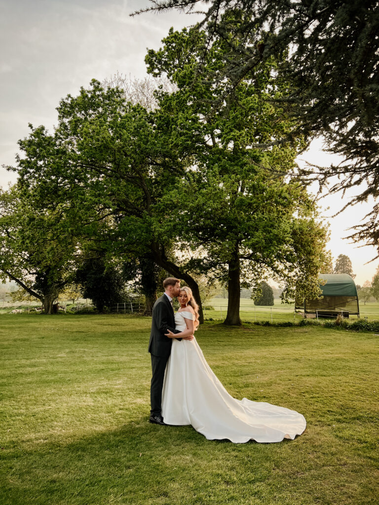 Bride and groom having a quiet moment at sunset captured by Essex wedding content creator The Unscripted