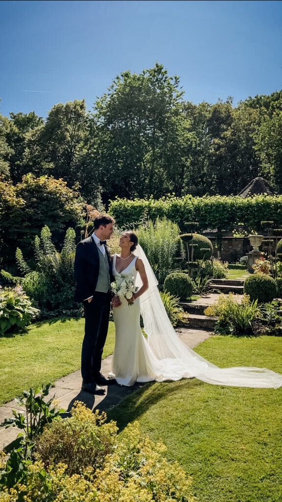 Couple having a quite moment in lush gardens captured by wedding content creator in Suffolk